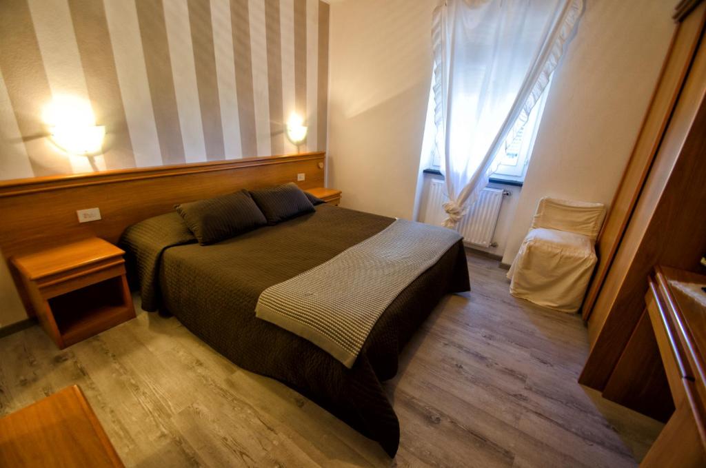 Postel nebo postele na pokoji v ubytování Albergo La Veranda