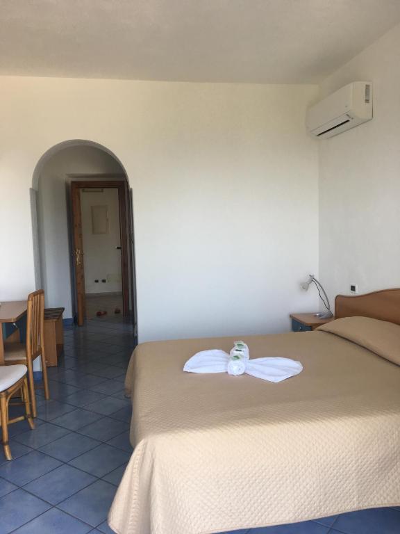 Postel nebo postele na pokoji v ubytování Hotel Casa Gerardo