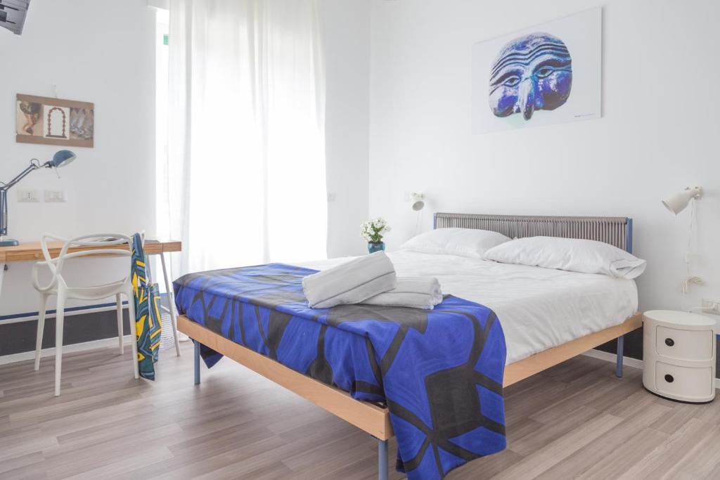 Posteľ alebo postele v izbe v ubytovaní Nonna Pina Art Rooms
