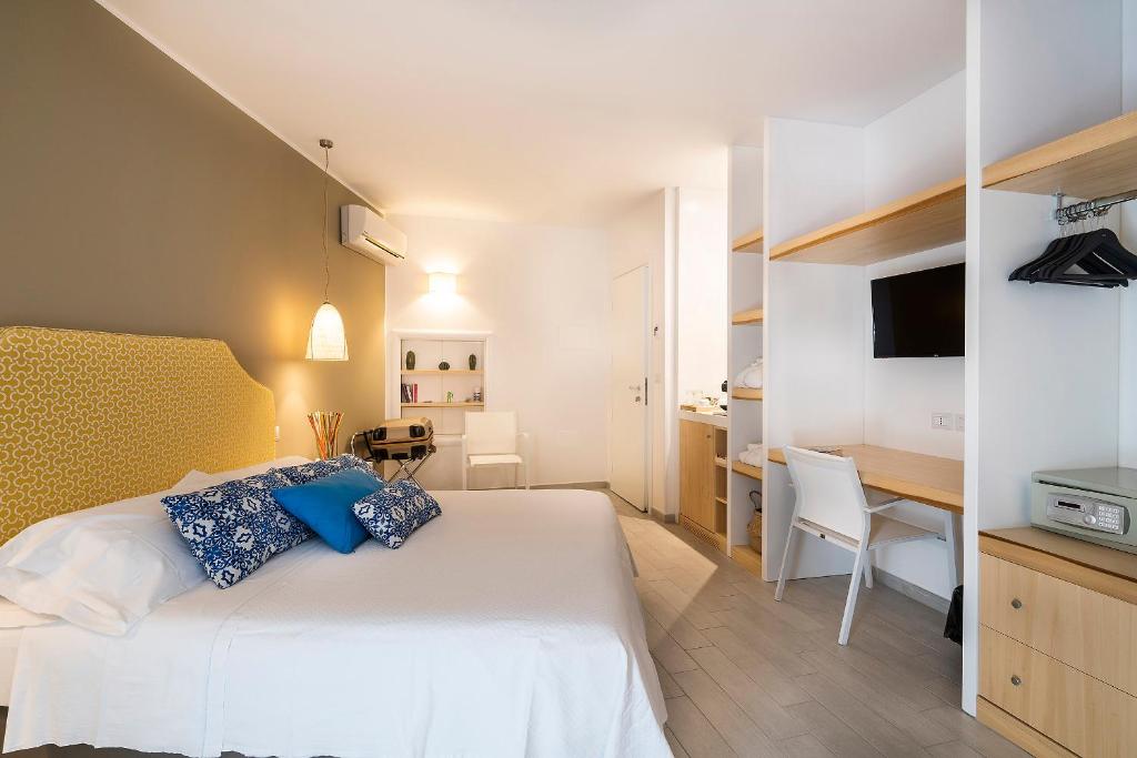 Postel nebo postele na pokoji v ubytování Hotel Orsa Maggiore