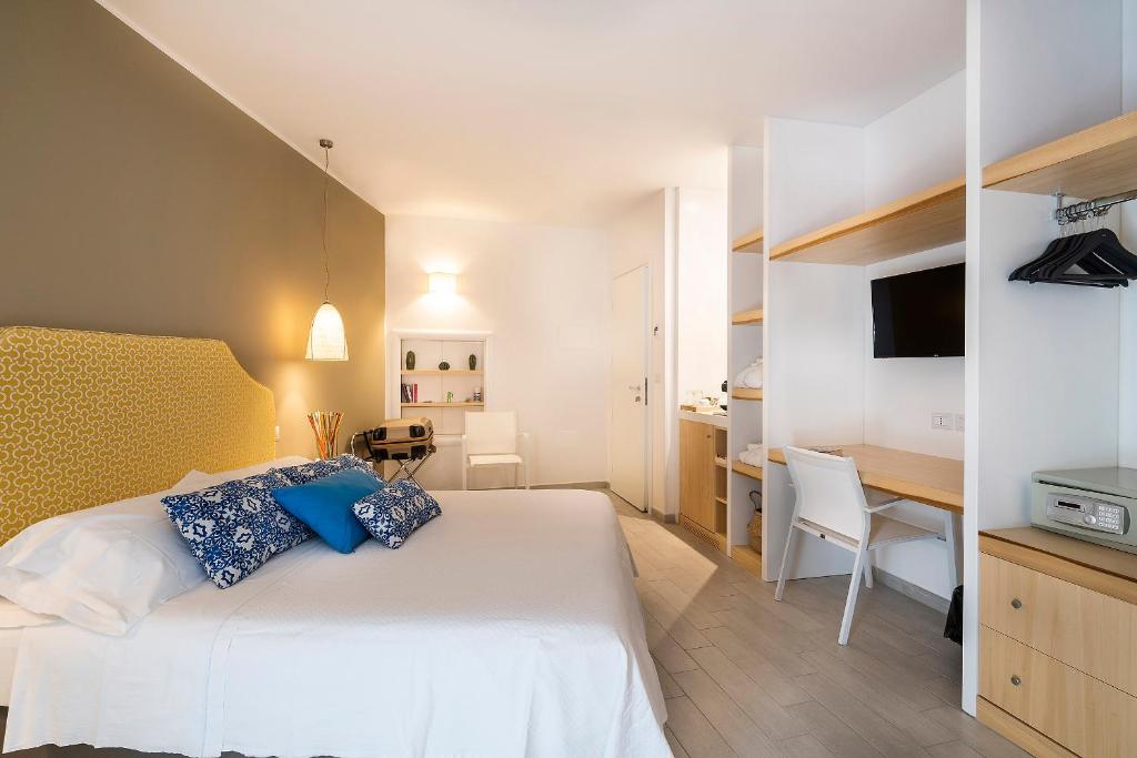 Postel nebo postele na pokoji v ubytování Hotel Orsa Maggiore