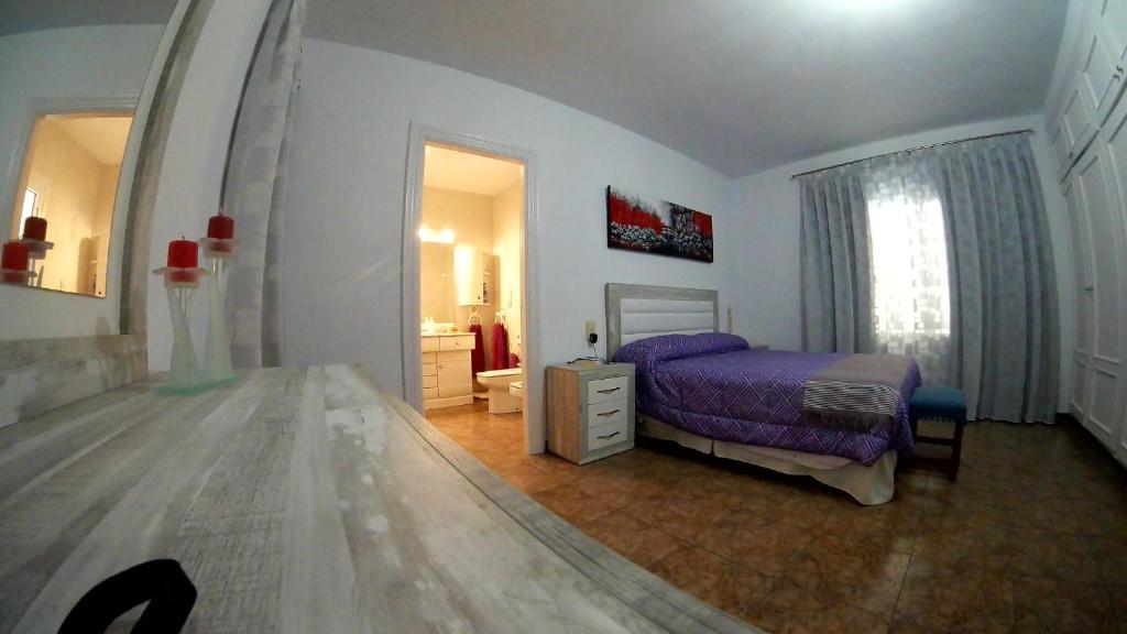 Postel nebo postele na pokoji v ubytování Villa PaloMayor
