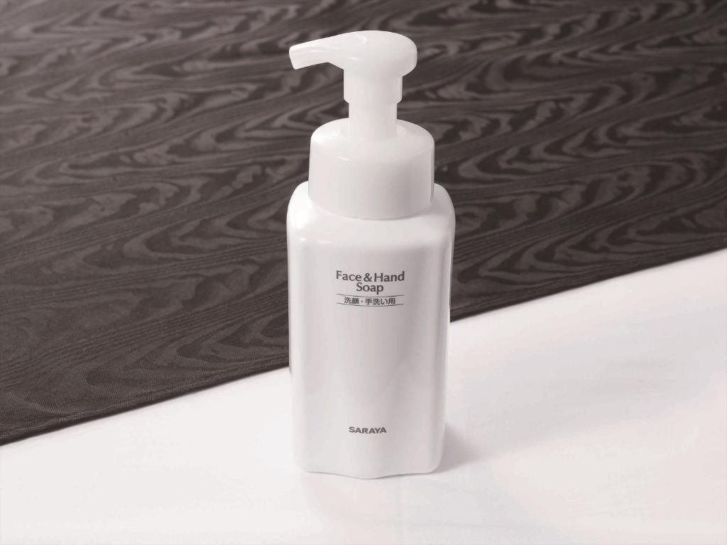 a white bottle of liquid soap sitting on a counter at APA Hotel Shibuya Dogenzakaue in Tokyo