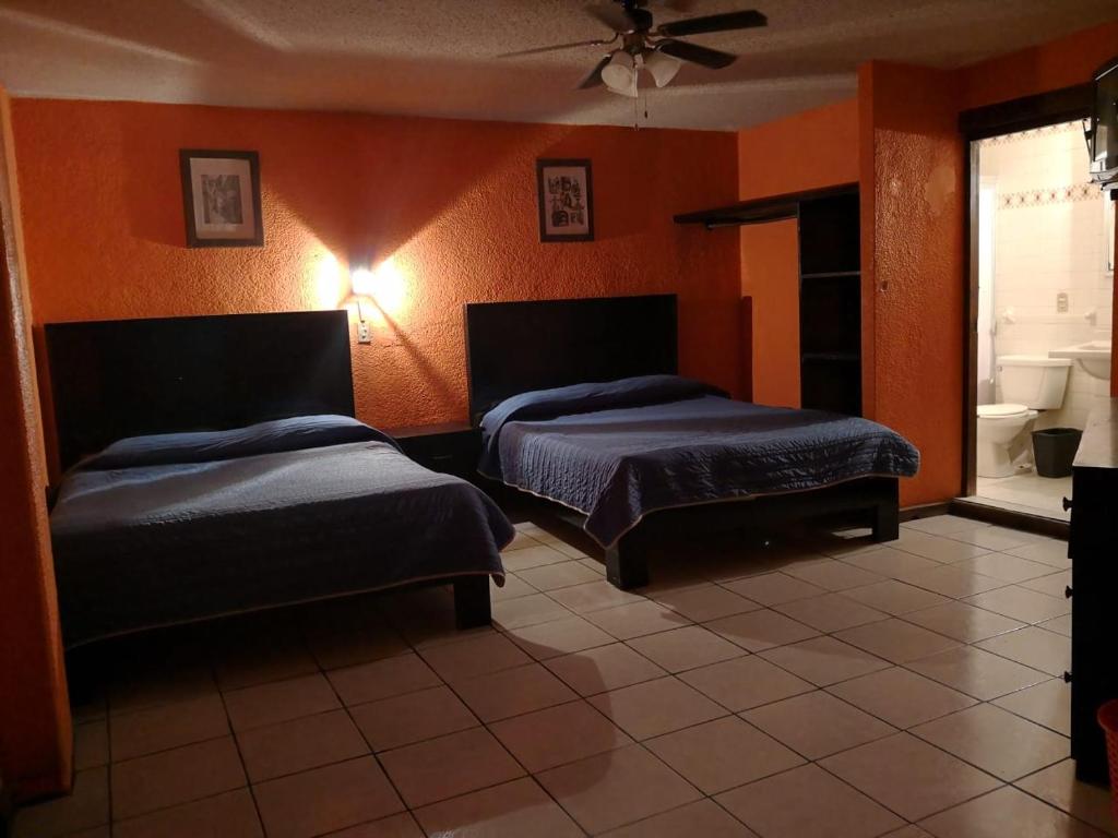 Postel nebo postele na pokoji v ubytování Hotel del Conde