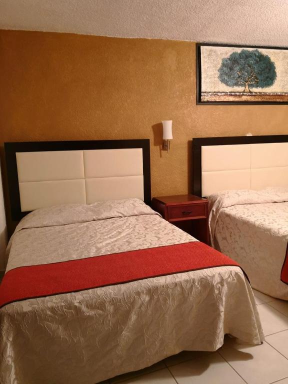 Postel nebo postele na pokoji v ubytování Hotel del Conde