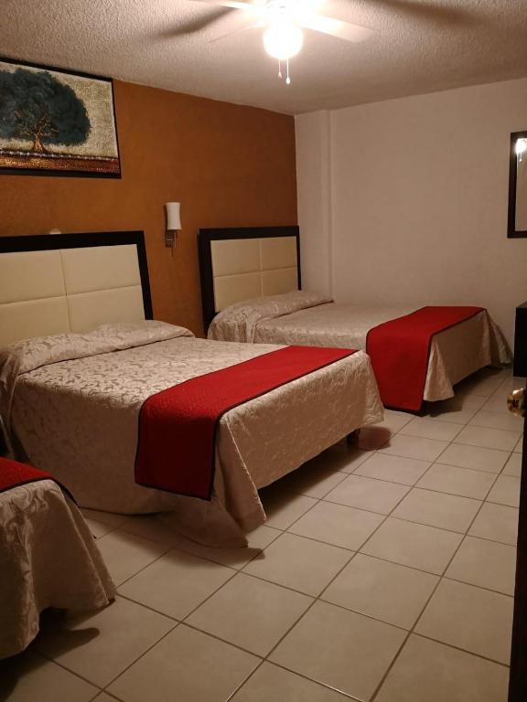 Postel nebo postele na pokoji v ubytování Hotel del Conde