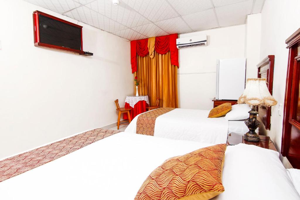 Postel nebo postele na pokoji v ubytování Hotel Flor de Liz