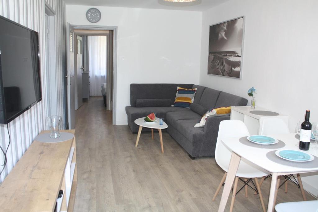 a living room with a couch and a table at Centrum in Szczecin