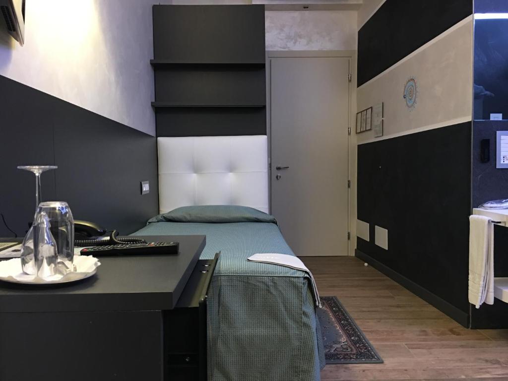 Postel nebo postele na pokoji v ubytování Hotel Universo