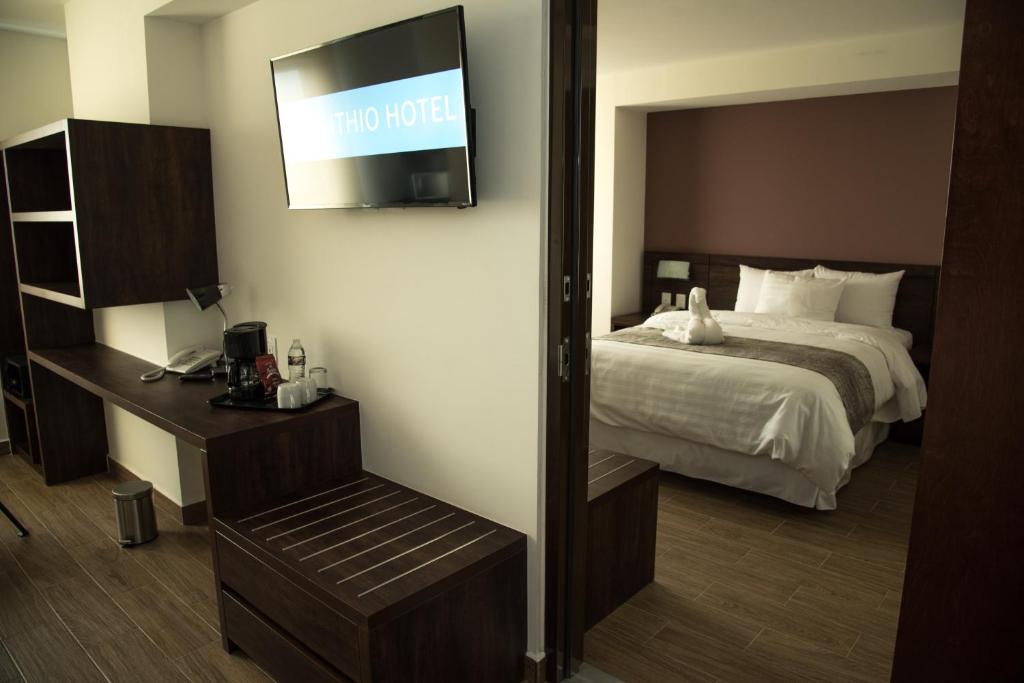 Postel nebo postele na pokoji v ubytování Lithio Hotel