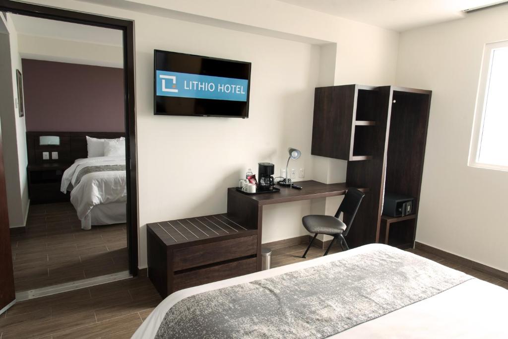 Postel nebo postele na pokoji v ubytování Lithio Hotel