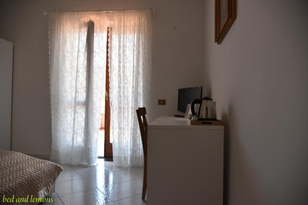 Postel nebo postele na pokoji v ubytování Bed and Lemons