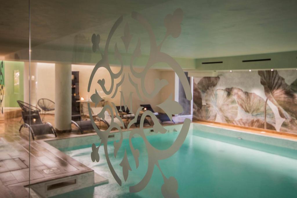 a living room with a table and a dining room at Mediterraneo Emotional Hotel & Spa in Santa Margherita Ligure