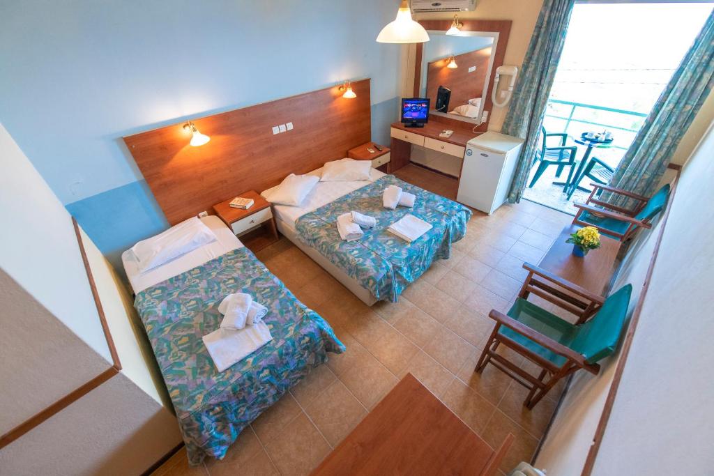 Postel nebo postele na pokoji v ubytování Sun Hotel