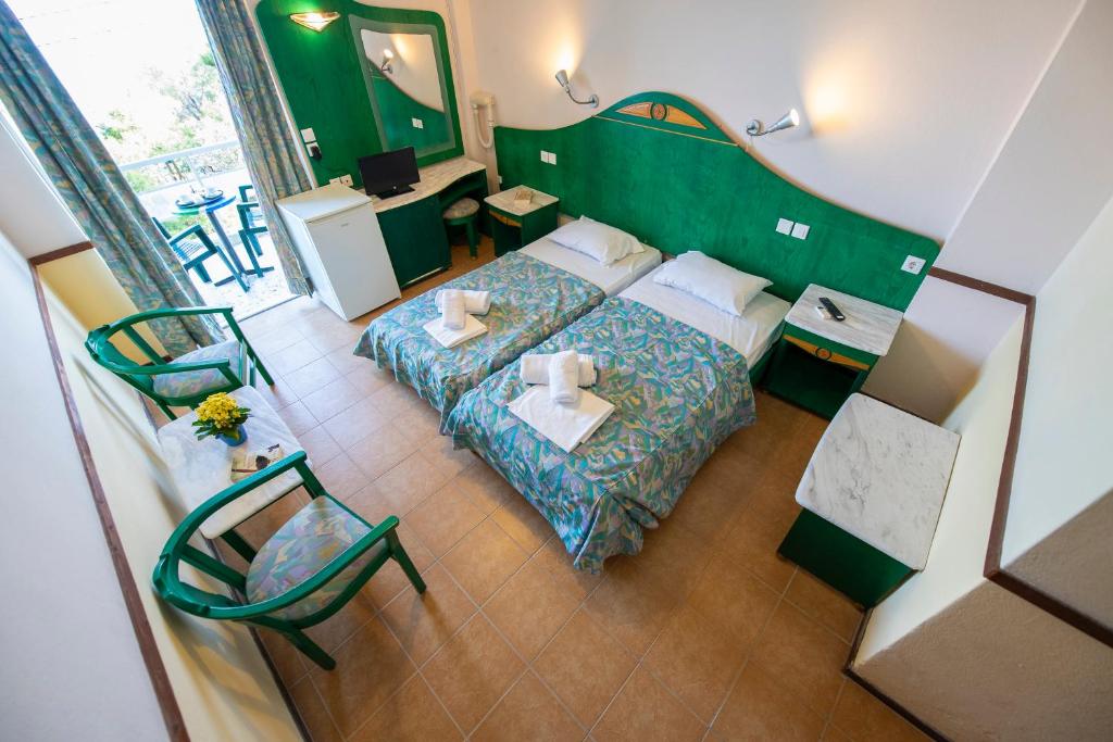 Postel nebo postele na pokoji v ubytování Sun Hotel