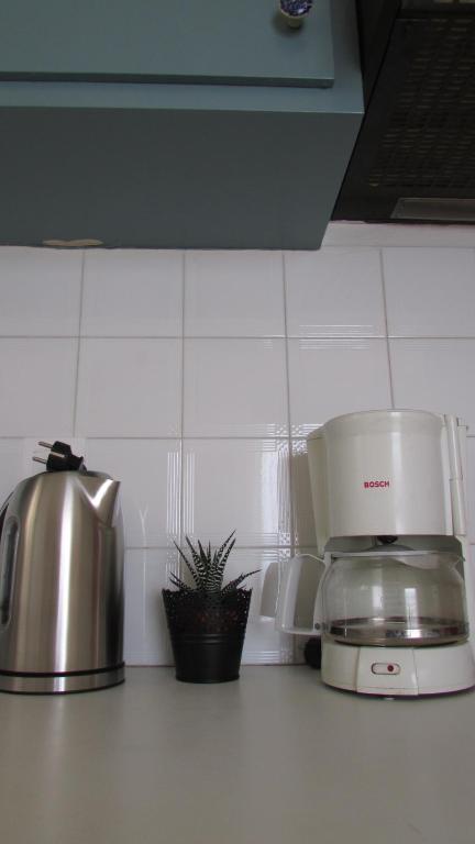 A kitchen or kitchenette at Kallopsia - Glifada Beach Menigos Resort by New Era