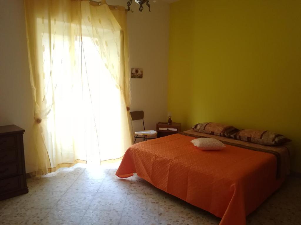 Ένα ή περισσότερα κρεβάτια σε δωμάτιο στο Case vacanze Della Corte