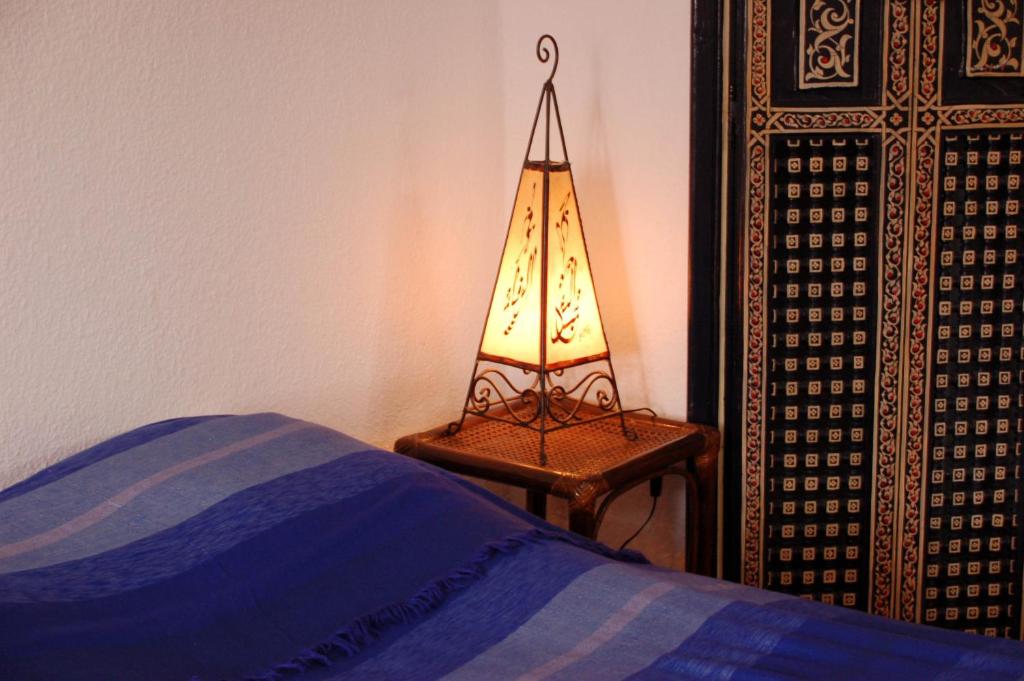 Postel nebo postele na pokoji v ubytování Riad Le Grand Large