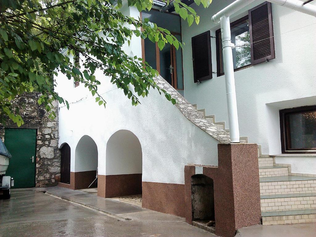 a building with arches on the side of it at Zelena Oaza Mira Bribir in Bribir