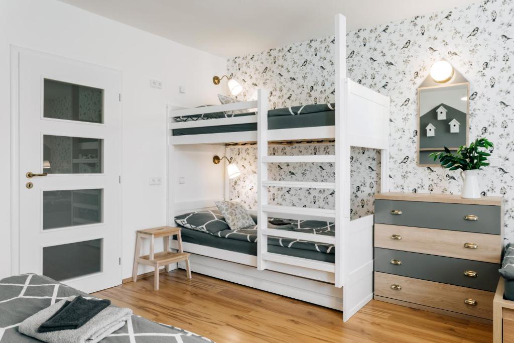 Postel nebo postele na pokoji v ubytování Penzion V Roklich & Apartmens V Roklich