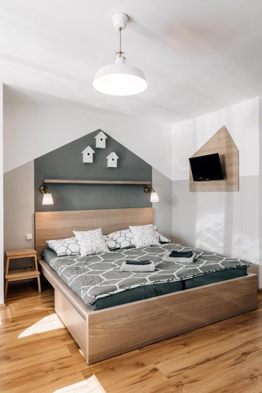 Postel nebo postele na pokoji v ubytování Penzion V Roklich & Apartmens V Roklich