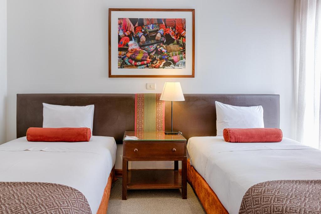 Postel nebo postele na pokoji v ubytování LP Los Portales Hotel Cusco