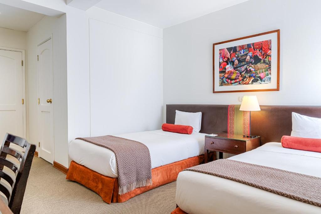 Postel nebo postele na pokoji v ubytování LP Los Portales Hotel Cusco