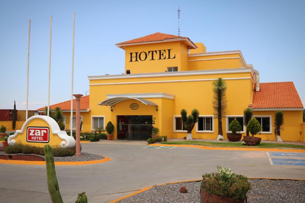 a hotel building with a hotel sign on top of it at Zar San Luis Potosi in San Luis Potosí