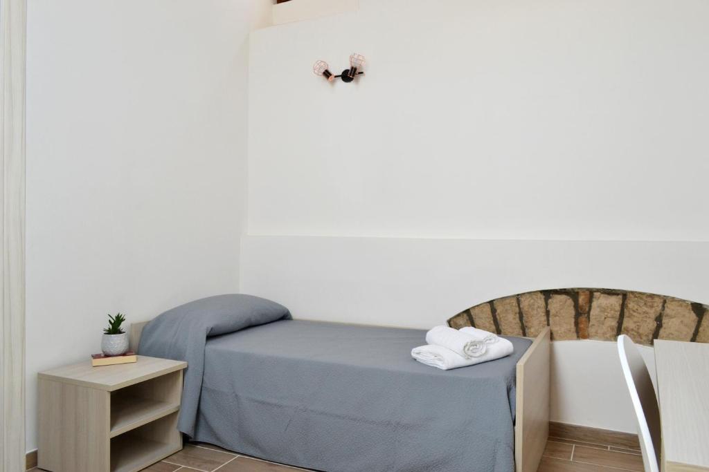 Postel nebo postele na pokoji v ubytování B&B Santa Lucia, Rapolla