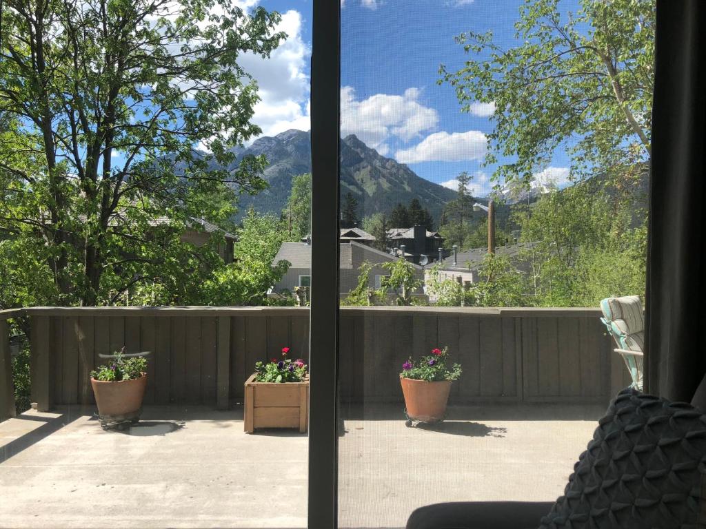 a view of a patio with two potted plants at Mountain View Bed & Breakfast in Banff