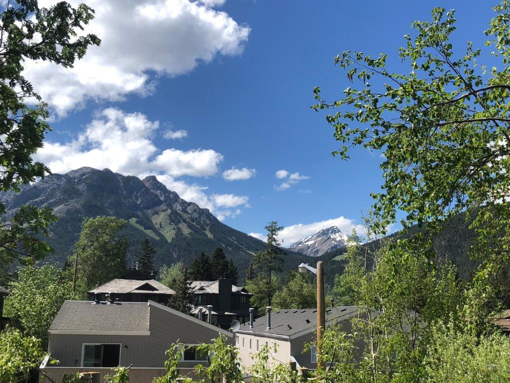 a view of a mountain with a house and trees at Mountain View Bed & Breakfast in Banff