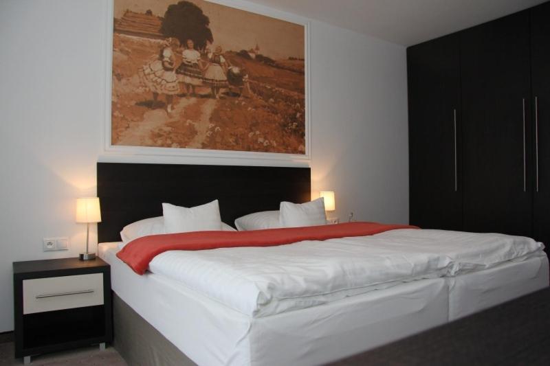 Postel nebo postele na pokoji v ubytování Hotel Mousson