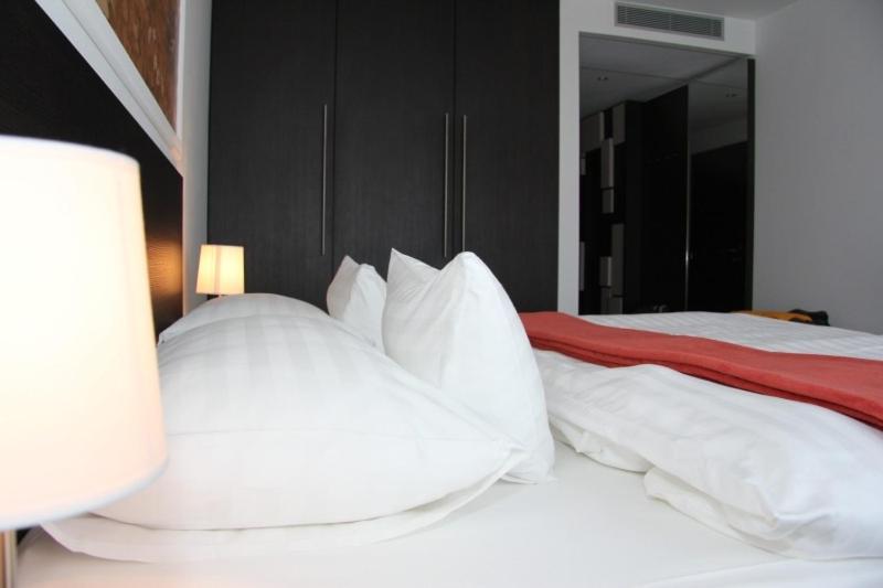 Postel nebo postele na pokoji v ubytování Hotel Mousson