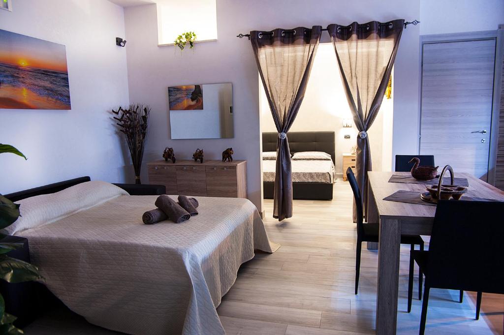 Łóżko lub łóżka w pokoju w obiekcie Guesthouse da Filiberto