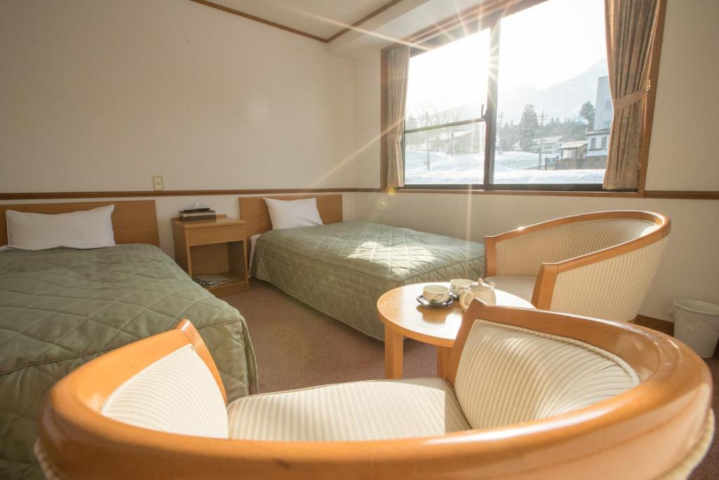 Postel nebo postele na pokoji v ubytování Refre Hotel