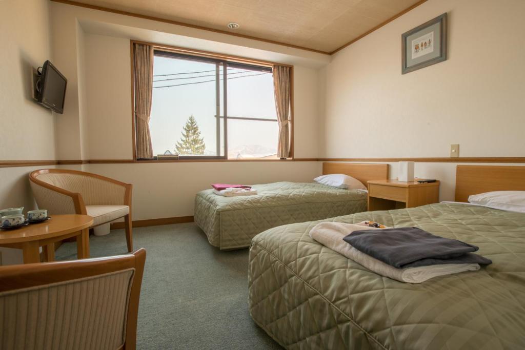 Postel nebo postele na pokoji v ubytování Refre Hotel