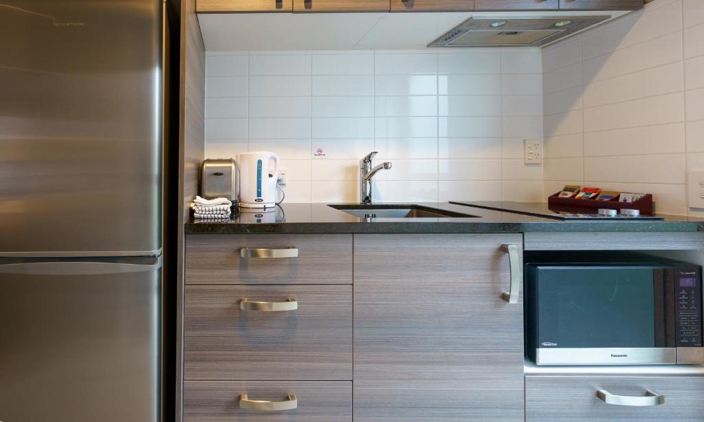 Kuchyň nebo kuchyňský kout v ubytování Apartments 118