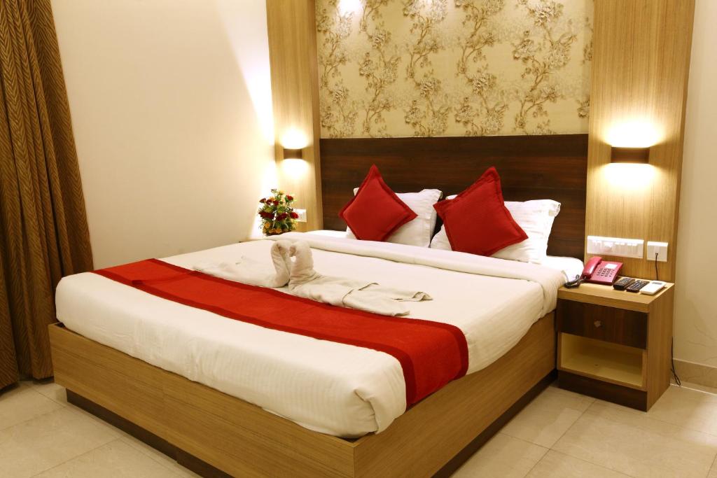 Postel nebo postele na pokoji v ubytování Prayana Hotels