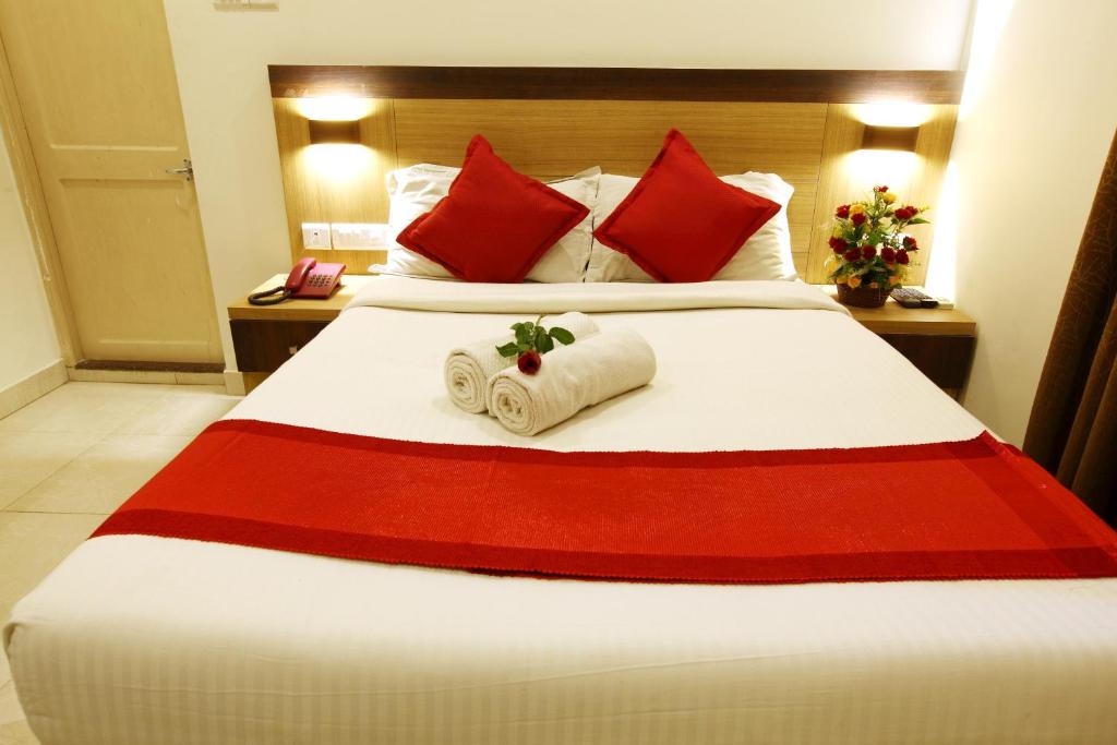 Postel nebo postele na pokoji v ubytování Prayana Hotels
