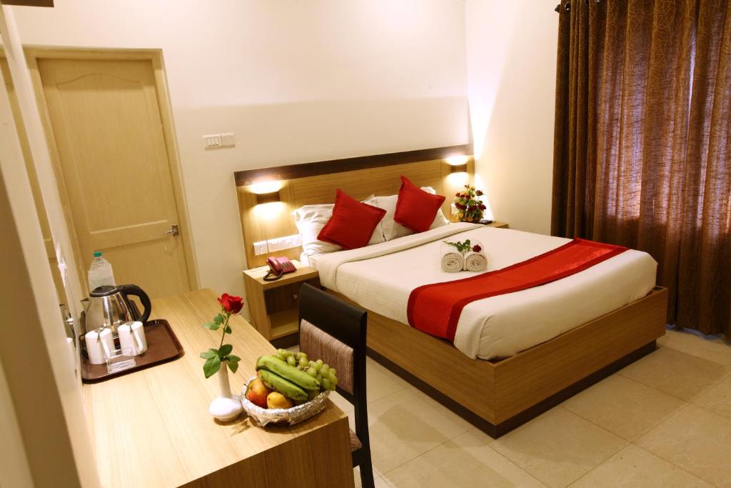 Postel nebo postele na pokoji v ubytování Prayana Hotels