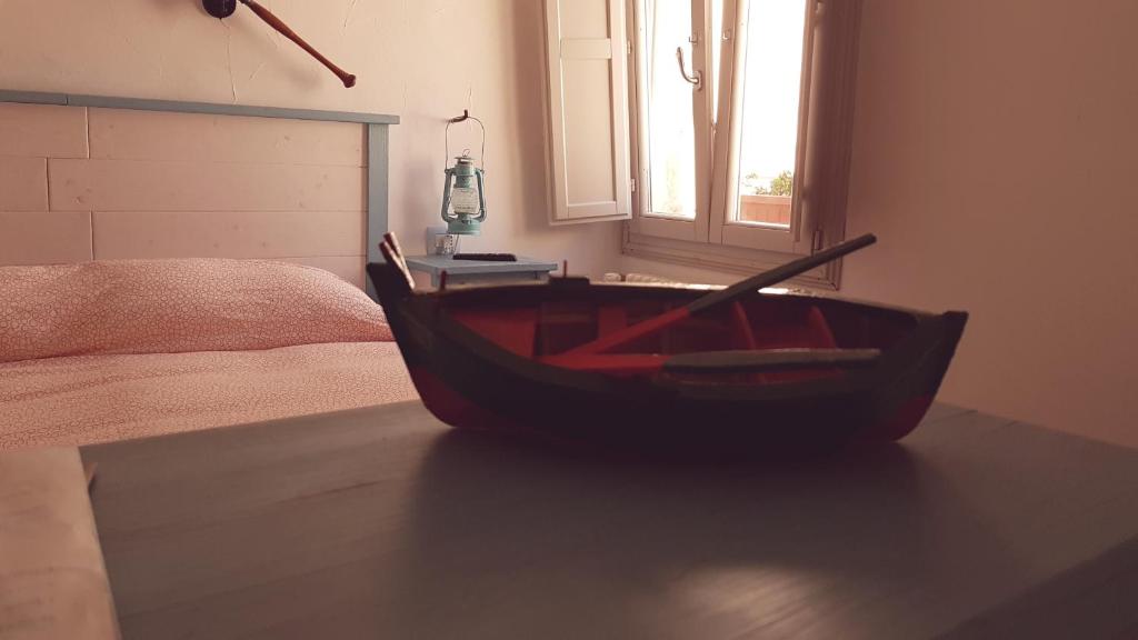 Postel nebo postele na pokoji v ubytování Casetta del Pescatore