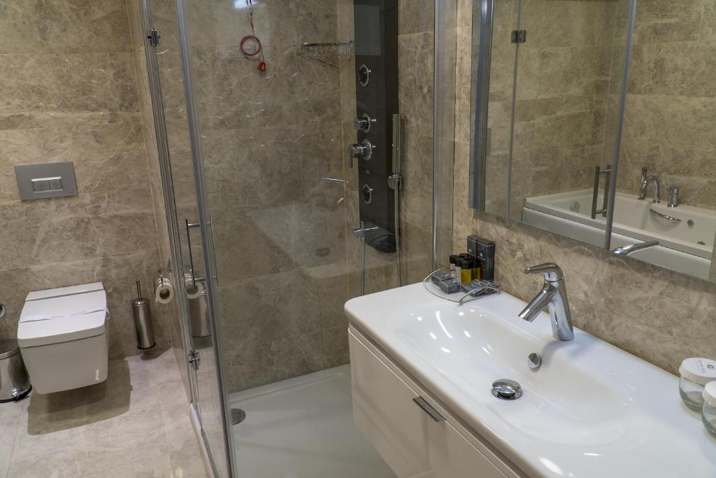 Koupelna v ubytování Greymark Hotel