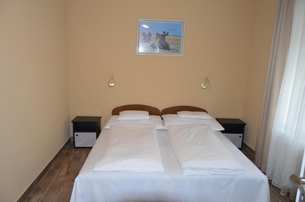 Posteľ alebo postele v izbe v ubytovaní Varga Apartman Hévíz