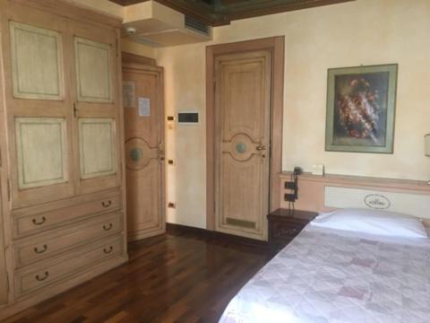 Postel nebo postele na pokoji v ubytování Hotel Il Chiostro