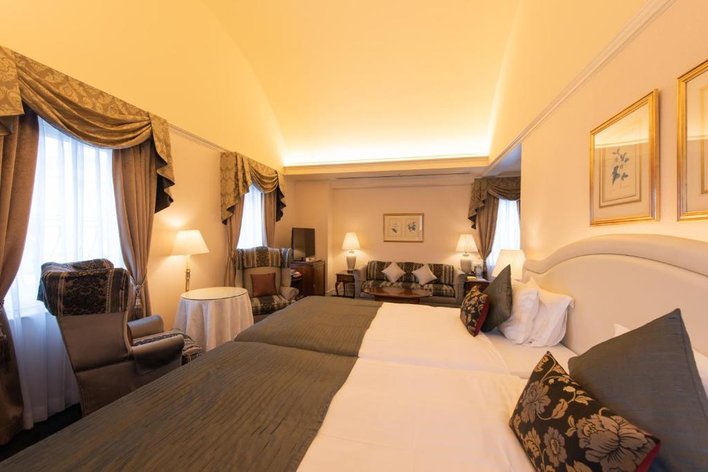 Postel nebo postele na pokoji v ubytování Kobe Kitano Hotel