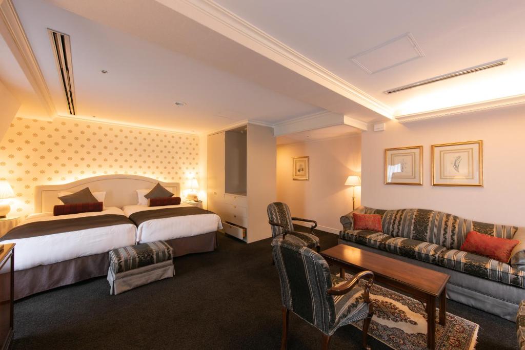 Postel nebo postele na pokoji v ubytování Kobe Kitano Hotel