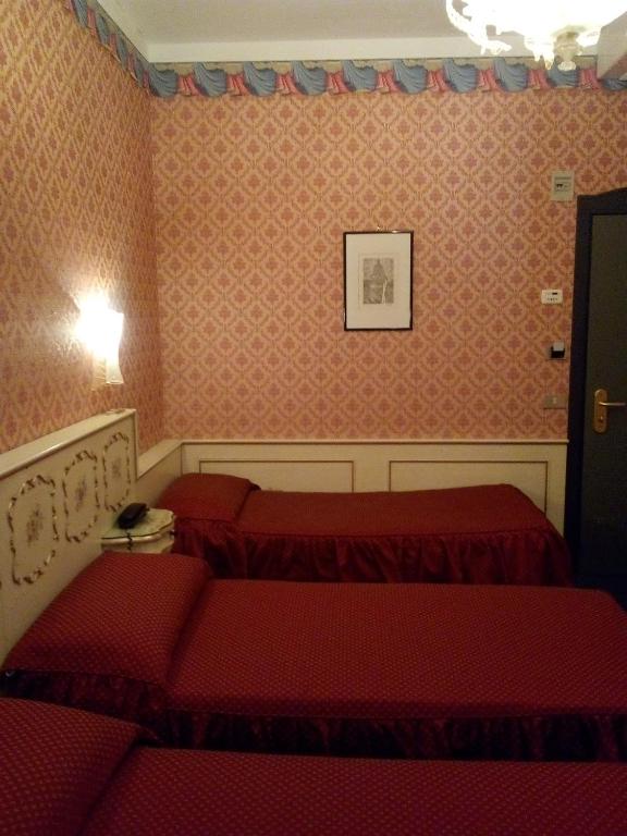Postel nebo postele na pokoji v ubytování Hotel Diana