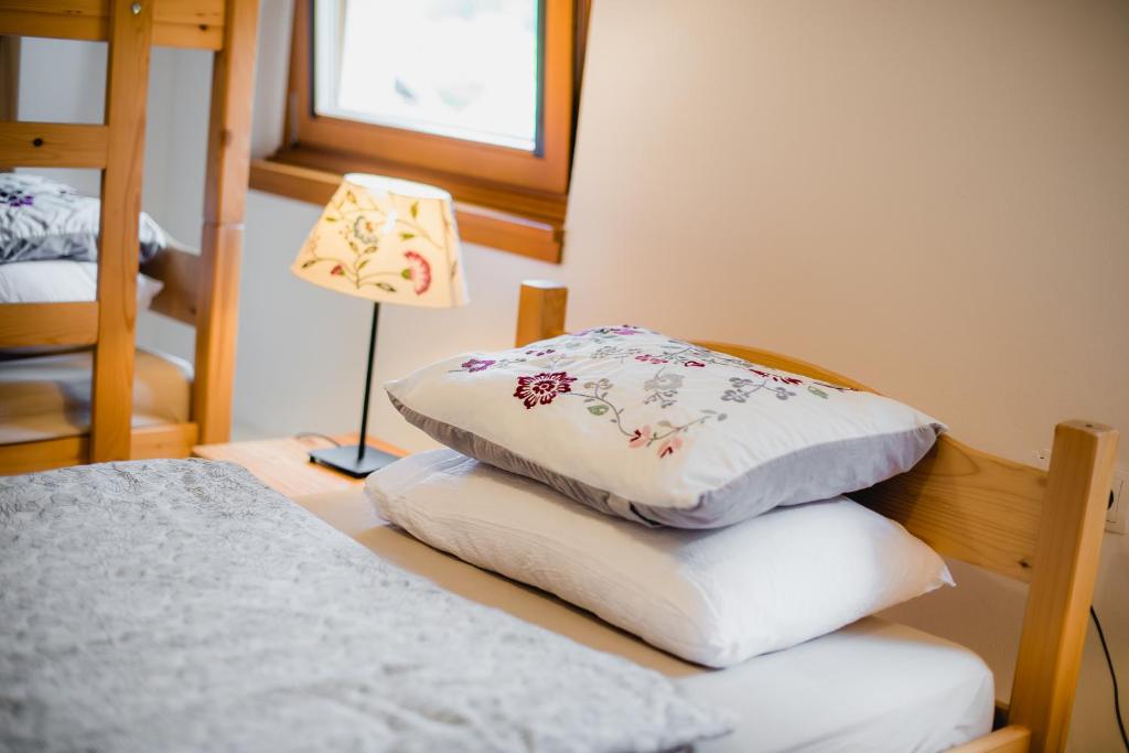 Postel nebo postele na pokoji v ubytování Rooms Kozmus