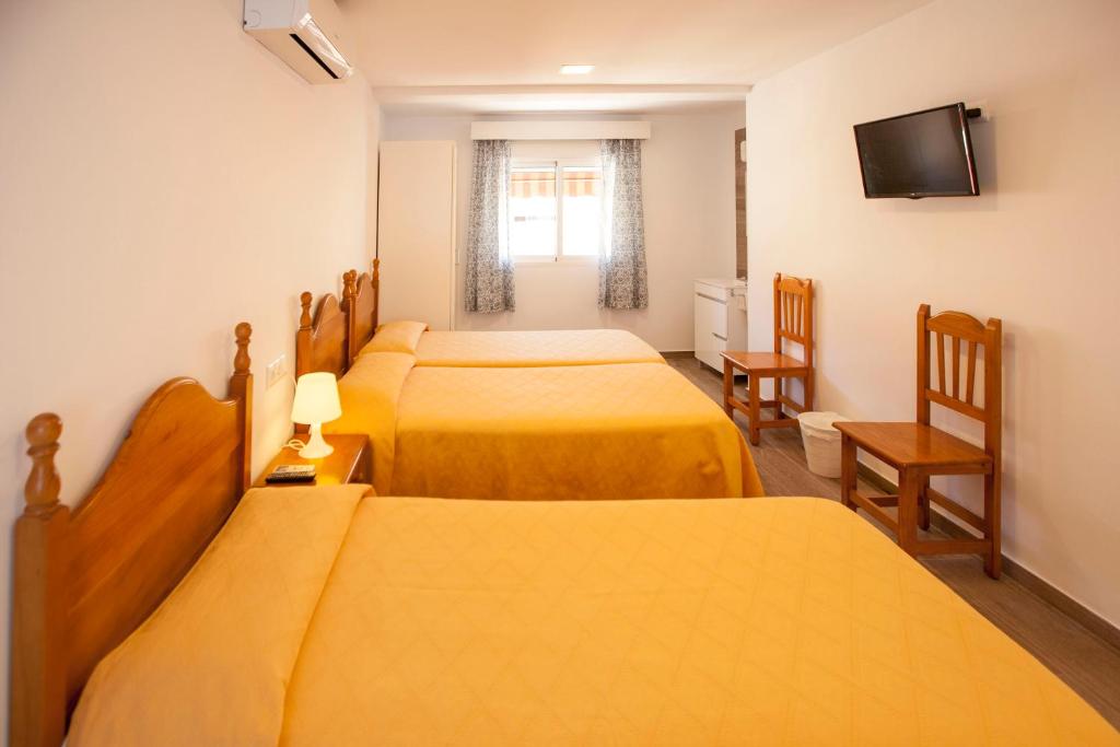 A bed or beds in a room at Serramar