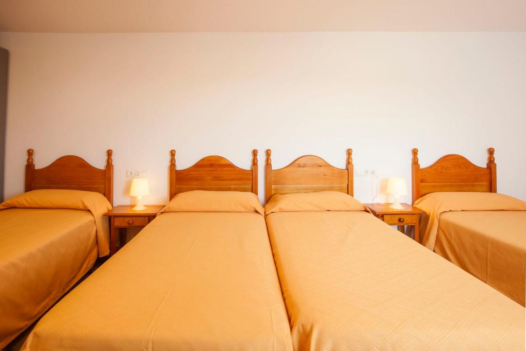 A bed or beds in a room at Serramar
